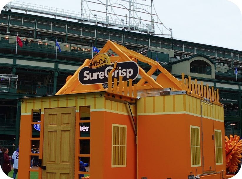 McCain® SureCrisp® Fry House installation outside Wrigley Field designed to look like a giant orange fry carton.